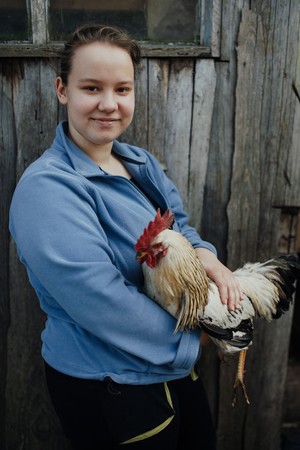 Lyudmyla helps tend to the animals her family raises for food and income